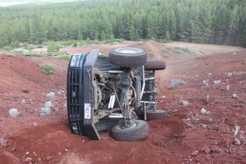 1995 Ford Bronco - This 1995 Ford Bronco has rolled onto its side in a rural, wooded area.