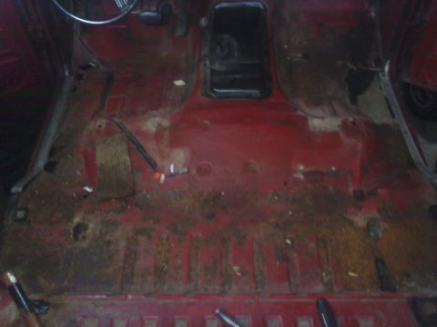 1978 Ford Bronco - Interior floor pan of a 1978 Ford Bronco, showing signs of rust and wear.