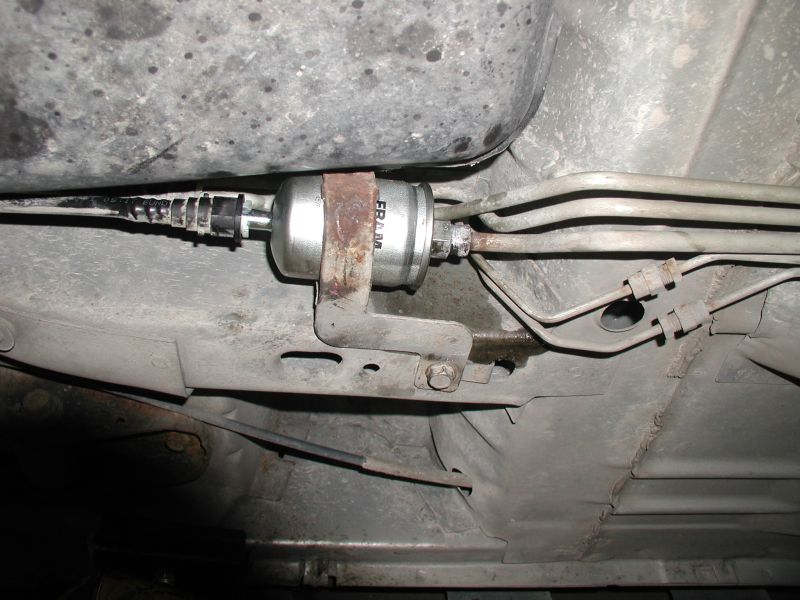 underbody shot of a fuel filter with fuel lines