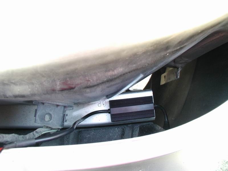 HID ballast and wiring attached to car bodywork