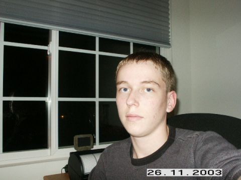 1998 Mercury Sable - A young man is pictured indoors, seated near a window.