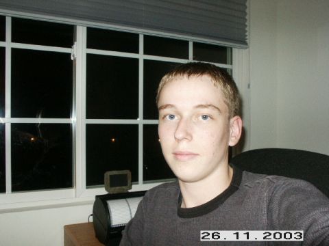 1998 Mercury Sable - A young man poses for a photo in front of a window with blinds. Text from a website is visible at the bottom.