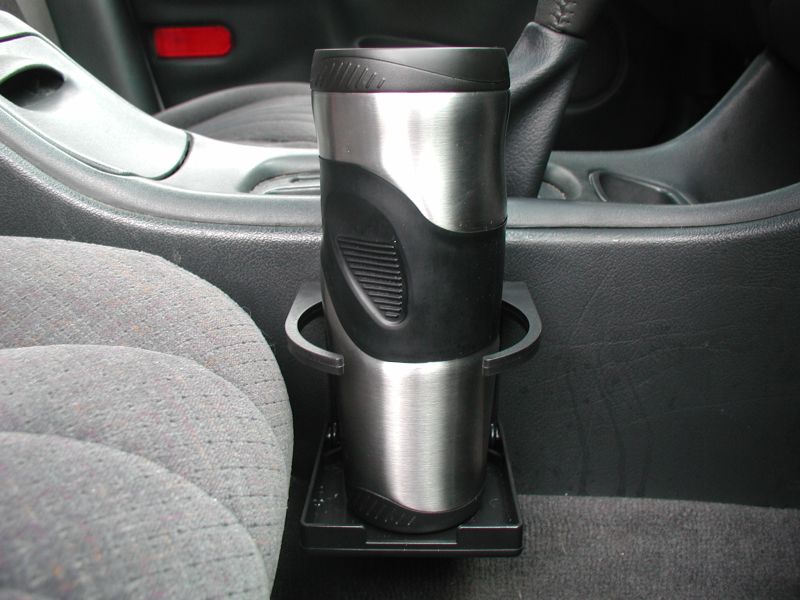 2002 Pontiac Grand Prix interior showing cup holder with travel mug and part of the passenger seat