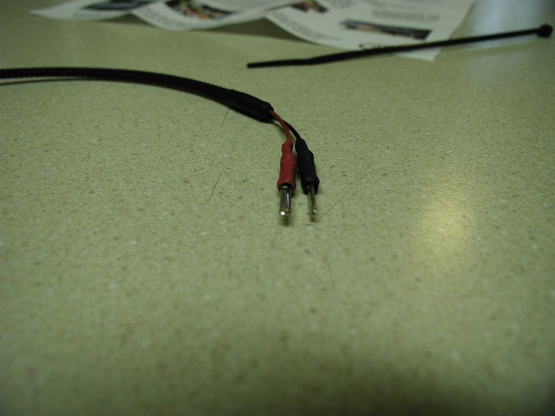Red and black wires with metal connectors