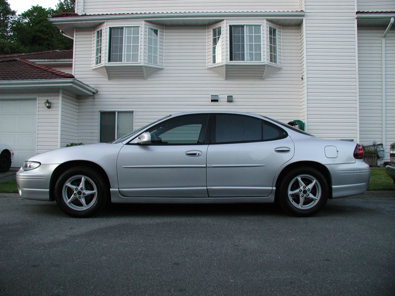 Silver 2002 Pontiac Grand Prix sedan, side view
