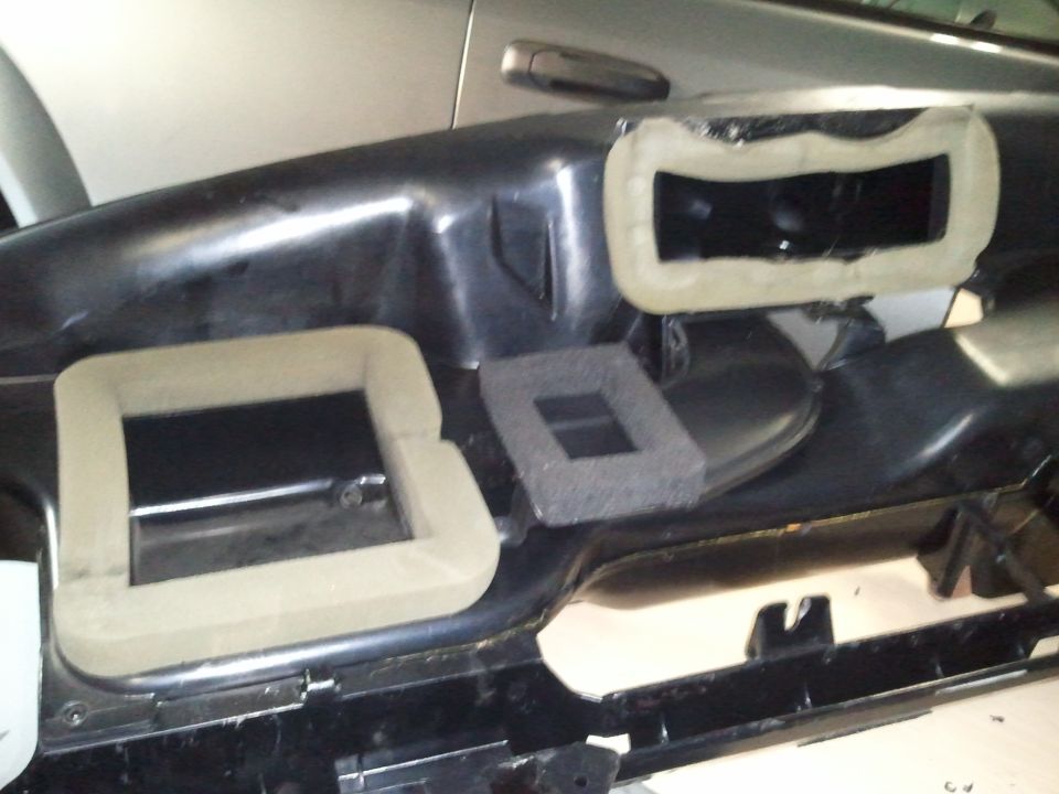 dashboard air vents with tape around them