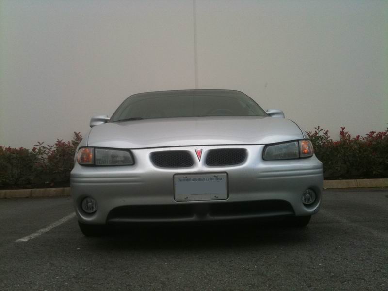 Silver 2002 Pontiac Grand Prix front view with HID fog lights