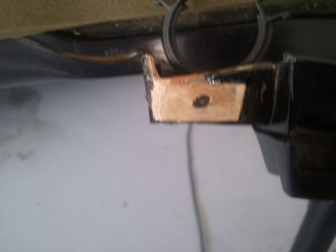 1994 Ford Bronco - A metal bracket is attached to the interior trim of a vehicle.