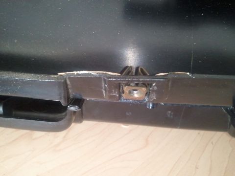 1994 Ford Bronco - Close-up of an interior vehicle part, showing a clip and nut fastener.