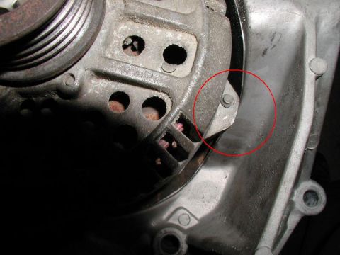 1990 Ford F-250 - This image shows a close-up view of an automotive alternator component, with a red circle drawn around a specific part.