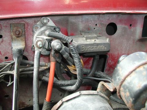 1990 Ford F-250 - This image shows a close-up view of a vehicle's electrical system, including a fuse box labeled 'Bussmann'.