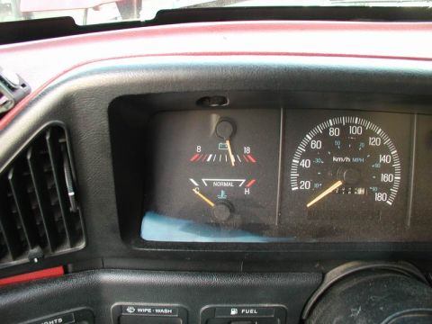 1990 Ford F-250 - Interior view of a vehicle's dashboard, showing various gauges and controls.
