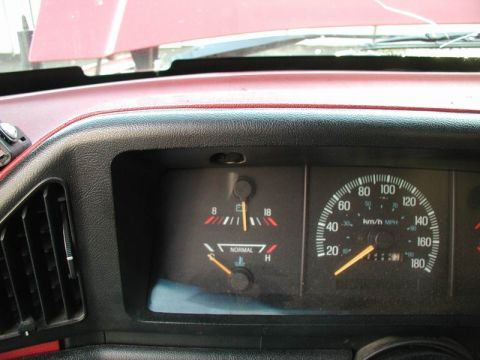 1990 Ford F-250 - Close-up of a vehicle's dashboard gauges, including speedometer and temperature gauge.