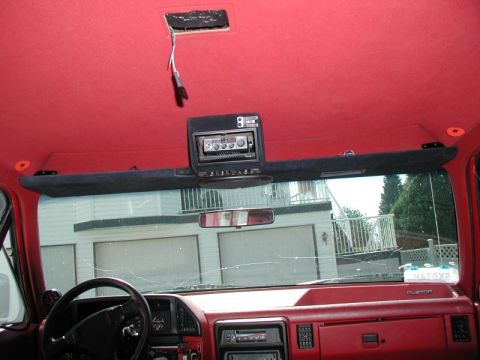 1990 Ford F-250 - Interior view of a 1990 Ford F-250 truck, showing the dashboard, steering wheel, and overhead CB radio.