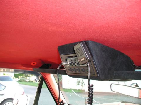 1990 Ford F-250 - Interior view of a CB radio installation with a microphone, and another vehicle seen through the windshield.
