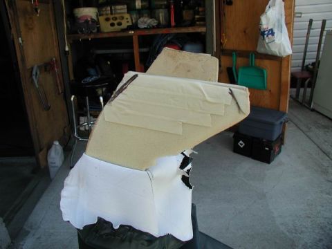 1990 Ford F-250 - This appears to be a damaged car seat cushion, not a 1990 Ford F-250 console.