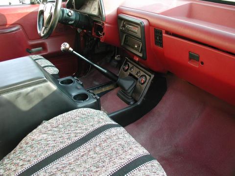 1990 Ford F-250 - Interior view of a 1990 Ford F-250, focusing on the center console and seating.