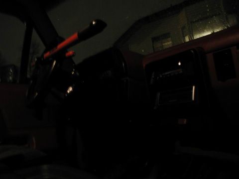 1990 Ford F-250 - Interior shot of a vehicle at night, with limited visibility of the dashboard and steering wheel.
