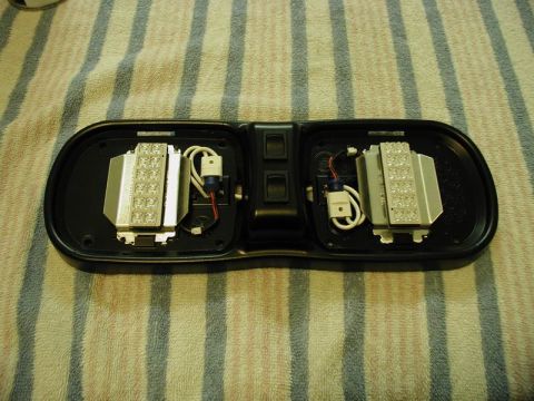 1990 Ford F-250 - Domelight assembly with two LED light modules and two switches, viewed from above.