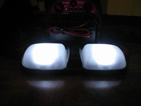 1990 Ford F-250 - Interior dome lights are on, with a battery charger visible behind them.