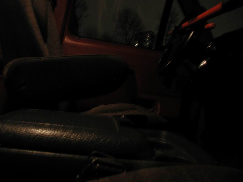 Interior view of a 1990 Ford F-250, showing the driver's seat and dashboard