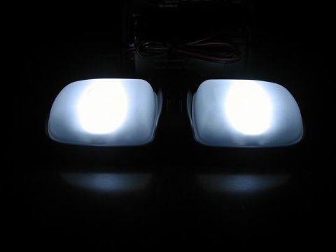 1990 Ford F-250 - Two bright white dome lights are shown illuminated against a dark background.