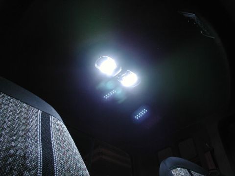 1990 Ford F-250 - Interior view of a vehicle's headliner with bright dome lights and LED strips.