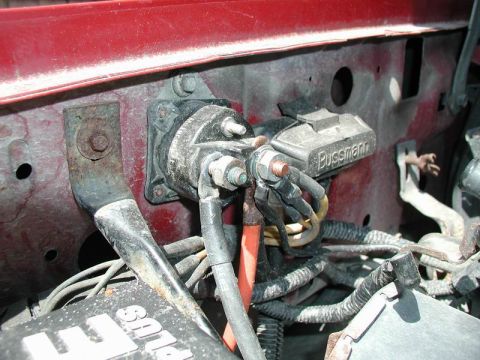 1990 Ford F-250 - Starter solenoid and associated wiring, with a Bussmann branded component visible.