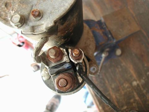 1990 Ford F-250 - Detail of a starter motor, showing electrical connections and mounting hardware.