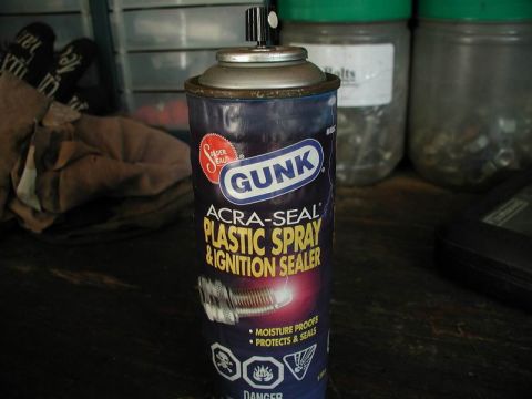 1990 Ford F-250 - A can of Gunk Acra-Seal Plastic Spray & Ignition Sealer is shown in a workshop setting.