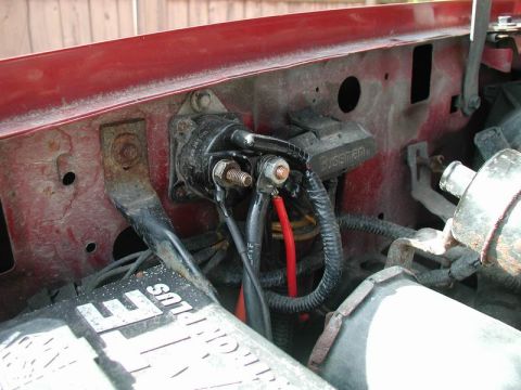 1990 Ford F-250 - Close-up of starter relay and battery connections, with a Bussmann fuse box.