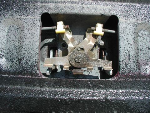 1990 Ford F-250 - Close-up view of the internal tailgate lock mechanism, likely from a truck.