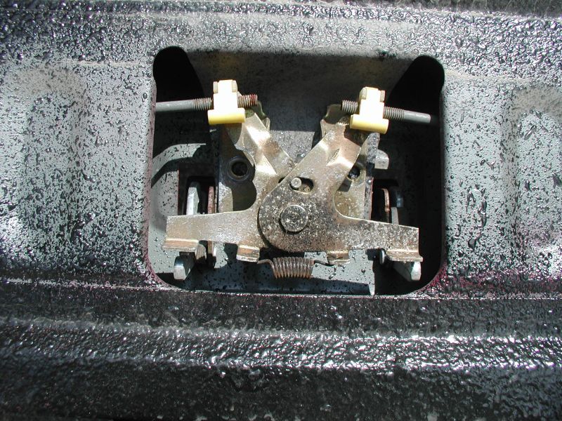 Tailgate lock mechanism inside a truck bed