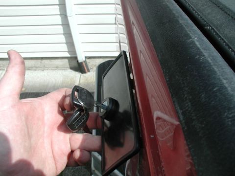 1990 Ford F-250 - Tailgate lock mechanism with keys inserted.