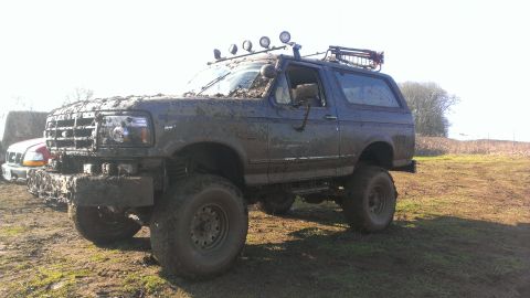 1995 Ford Bronco - Muddy 1995 Ford Bronco on a farm, equipped for off-road adventures.