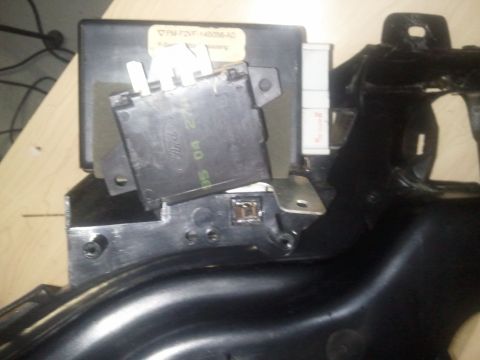 1994 Ford Bronco - Close-up of a Ford electronic control module, possibly from a vehicle's interior.