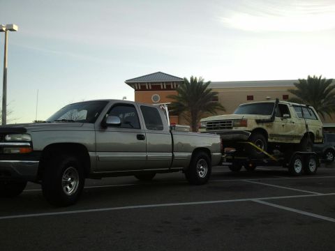 1988 Ford Bronco - My friends trailering it to Redneck Yatch Club. Its strapped down alot better than it appears