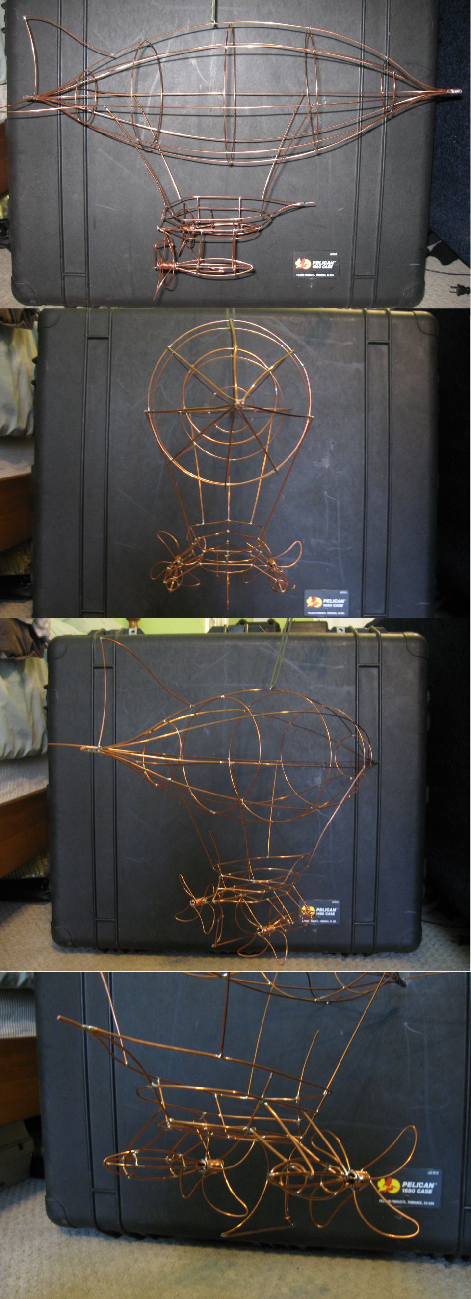 wireframe models of airships on black cases