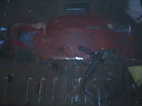 1978 Ford Bronco - Interior floor of a vehicle with rust and repair tools visible.