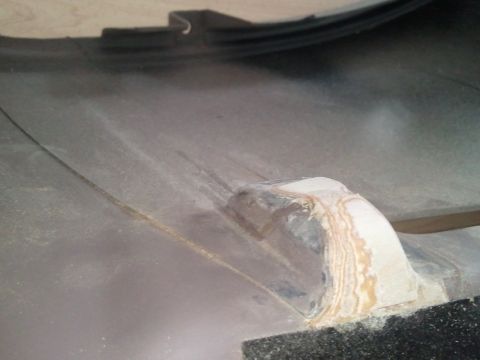 1994 Ford Bronco - Close-up of a dashboard component, showing surface texture and evidence of repair.