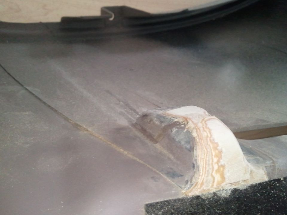 Dashboard part with textured surface and repair work