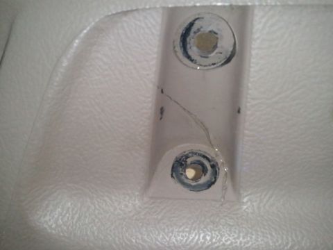 1994 Ford Bronco - Cracked interior trim piece with mounting hardware visible.