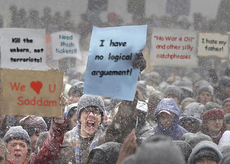1980 Ford Bronco - Edited photo of a protest crowd in falling snow with several hand-lettered signs digitally replaced by satirical slogans, the largest readi…