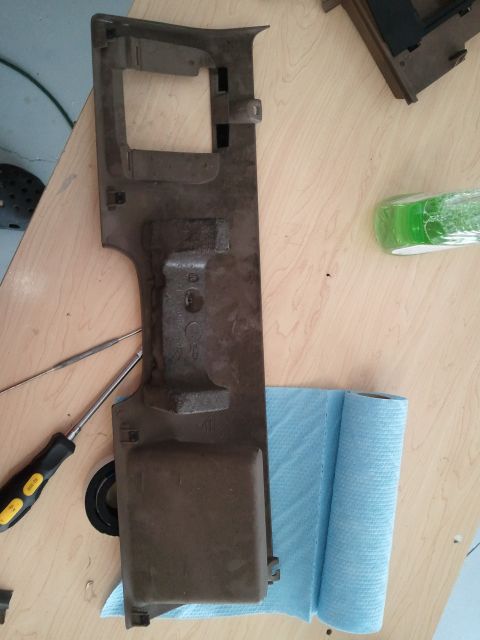 1994 Ford Bronco - Interior trim piece with tools on a workbench.