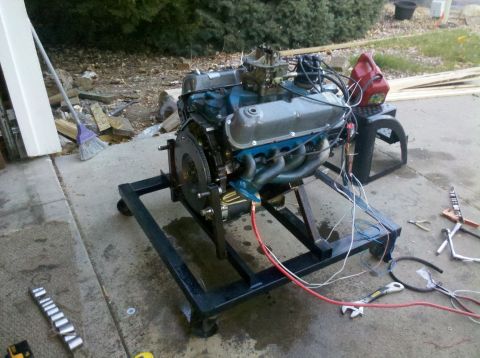 1996 Ford Bronco - Engine assembly mounted on a rolling stand, ready for testing or installation.