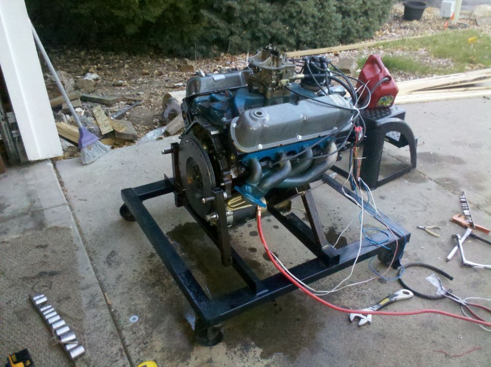 Engine on a stand with headers and carburetor