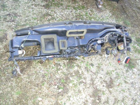1994 Ford Bronco - Dashboard assembly removed from a vehicle, showing its internal components and wiring.