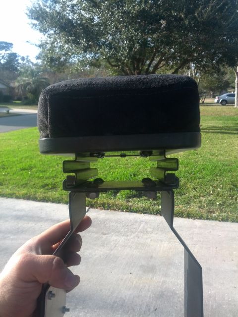 1989 BMW 3 Series - Air filter assembly held by hand, with a suburban street and trees in the background.