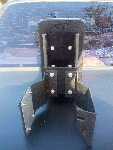 1989 BMW 3 Series - This hitch receiver mount, branded HUSCO, is attached to the rear of a vehicle.