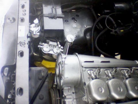 1983 Ford F-100 - Close-up view of an engine compartment, showing mechanical components and wiring.